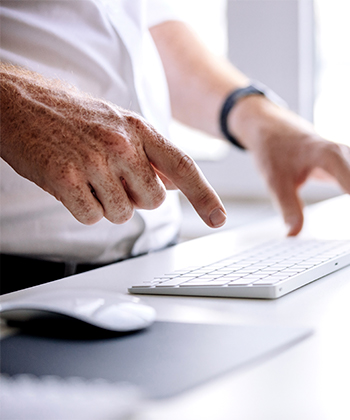 hands typing on a laptop